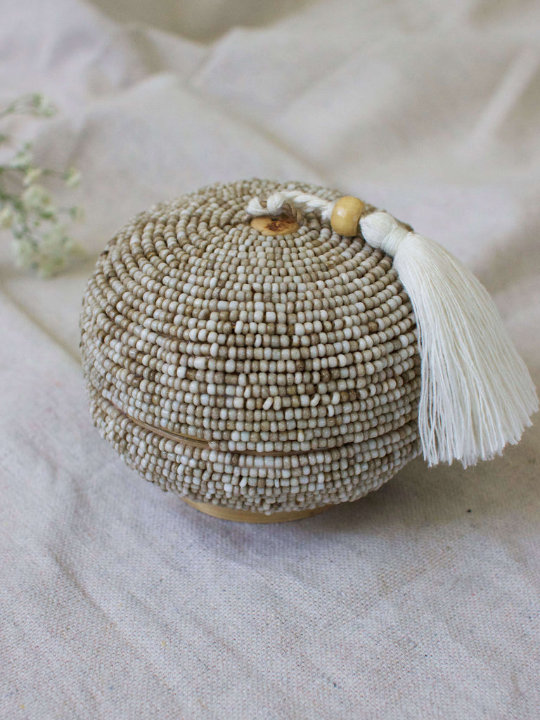 mini round hand-beaded tan bamboo basket with cream tassel