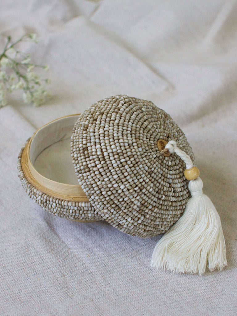 mini round hand-beaded tan bamboo basket with cream tassel