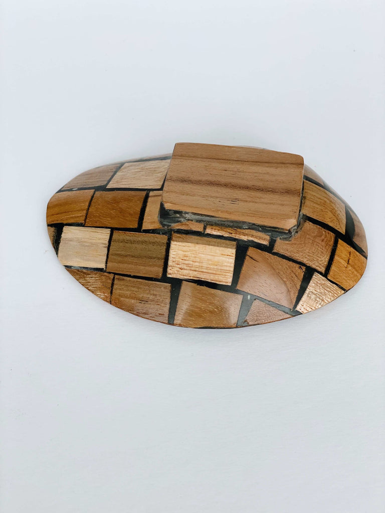 back detail of wood encased abalone shell