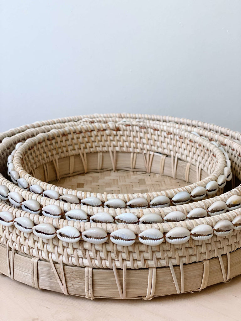 set of three handmade bamboo nesting baskets with unique cowrie shell detail