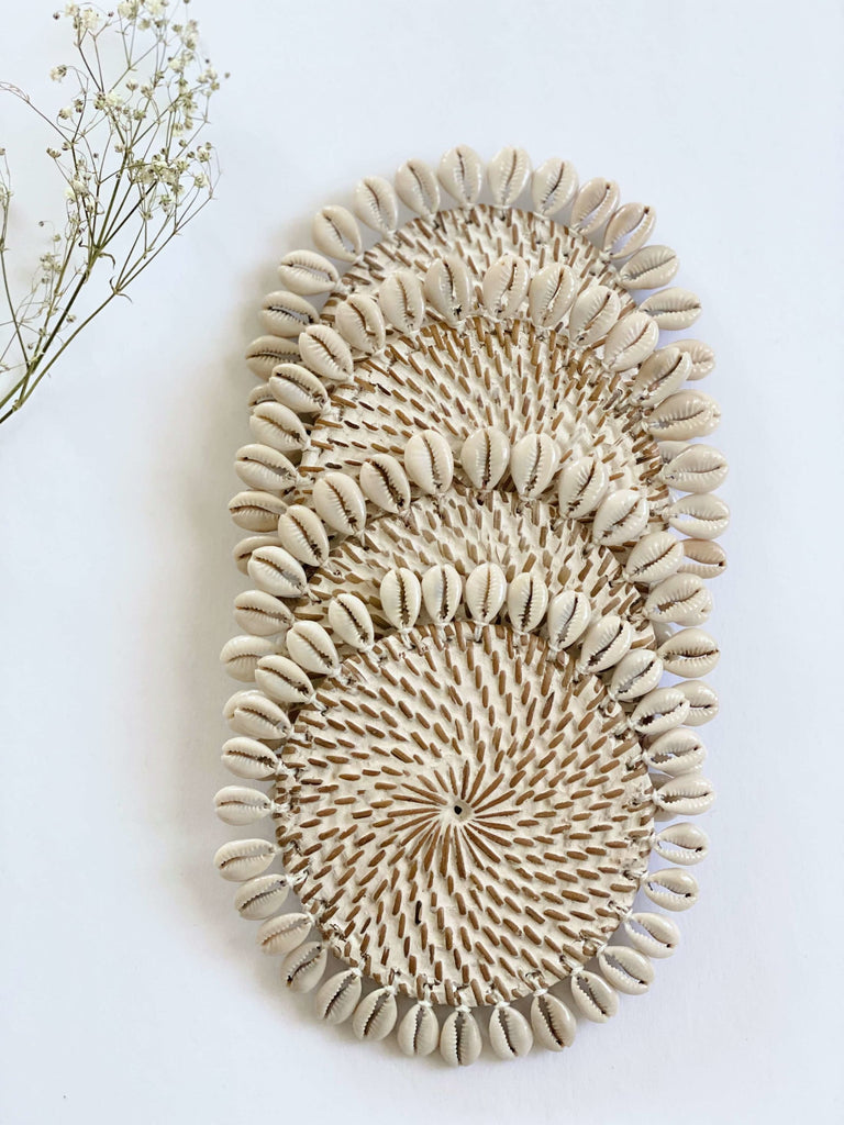 set of 4 rattan shell beverage coasters that have been handpainted a whitewash finish