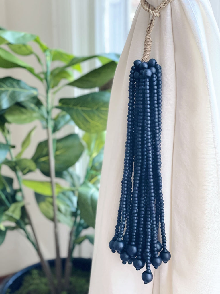handmade black wooden bead jute tie back tassel used as curtain tie back next to fiddle leaf fig