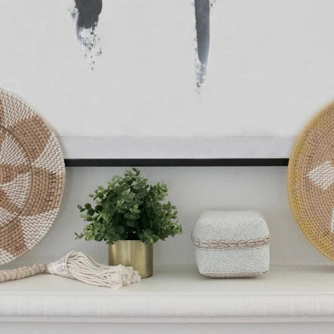 handmade rattan wall baskets on mantel