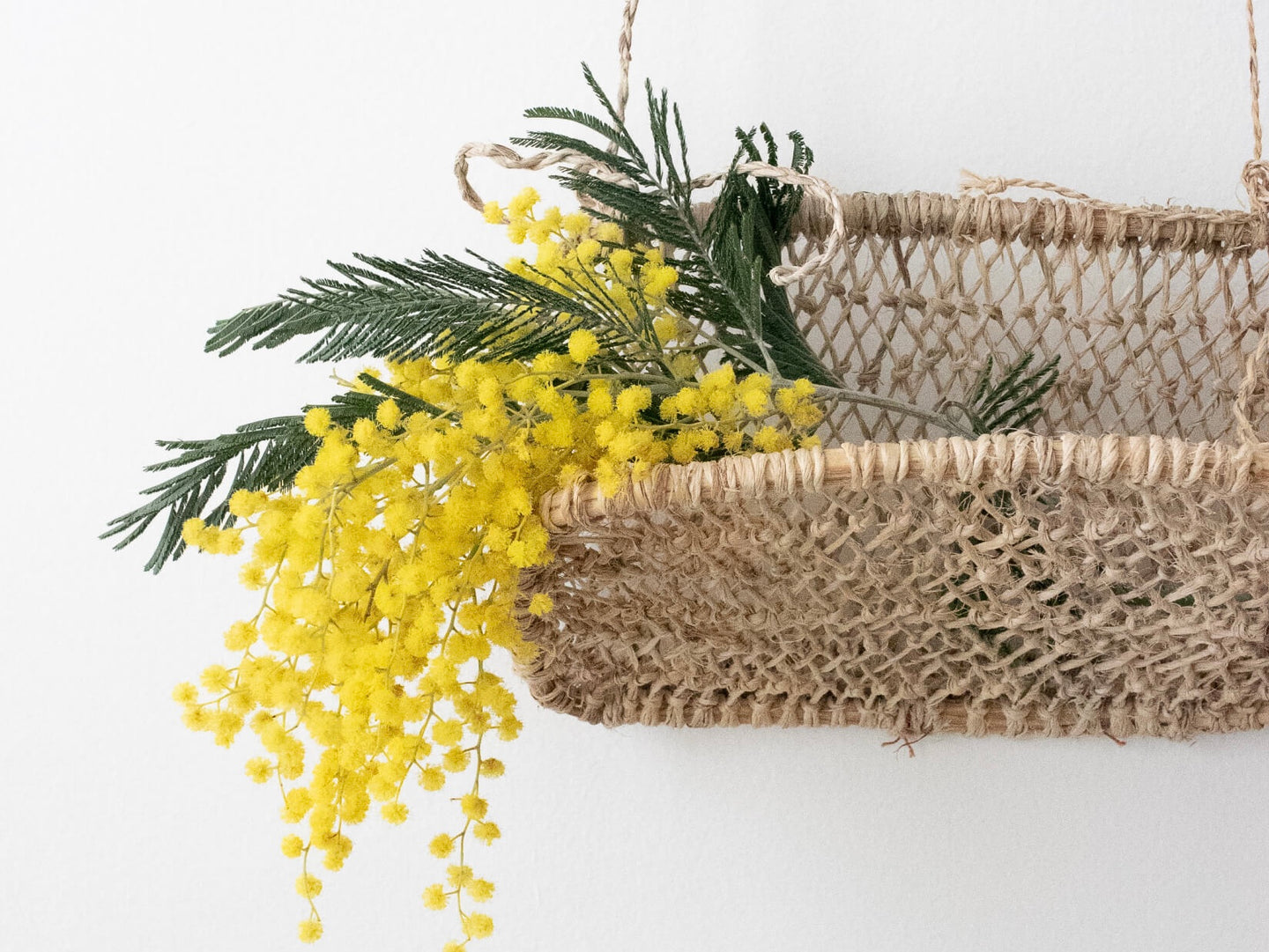 handwoven huacal jonote basket holding dried florals