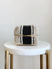 mini hand-beaded black and white bamboo basket on white marble stool