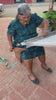 video of Indigenous artisan woman in Oaxaca using the waistloom to make our throw pillow covers