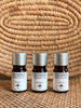 set of three cempaka frangipani jasmine essential oils with woven wicker background 
