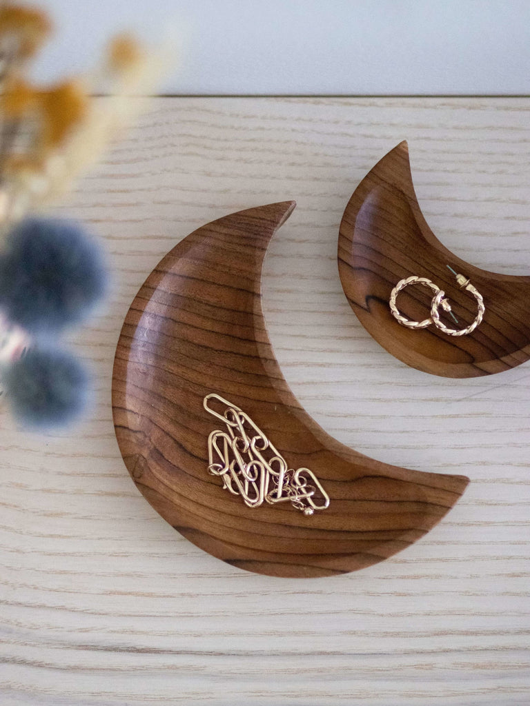 set of two handcarved crescent moon teak wood dishes holding dainty feminine jewelry