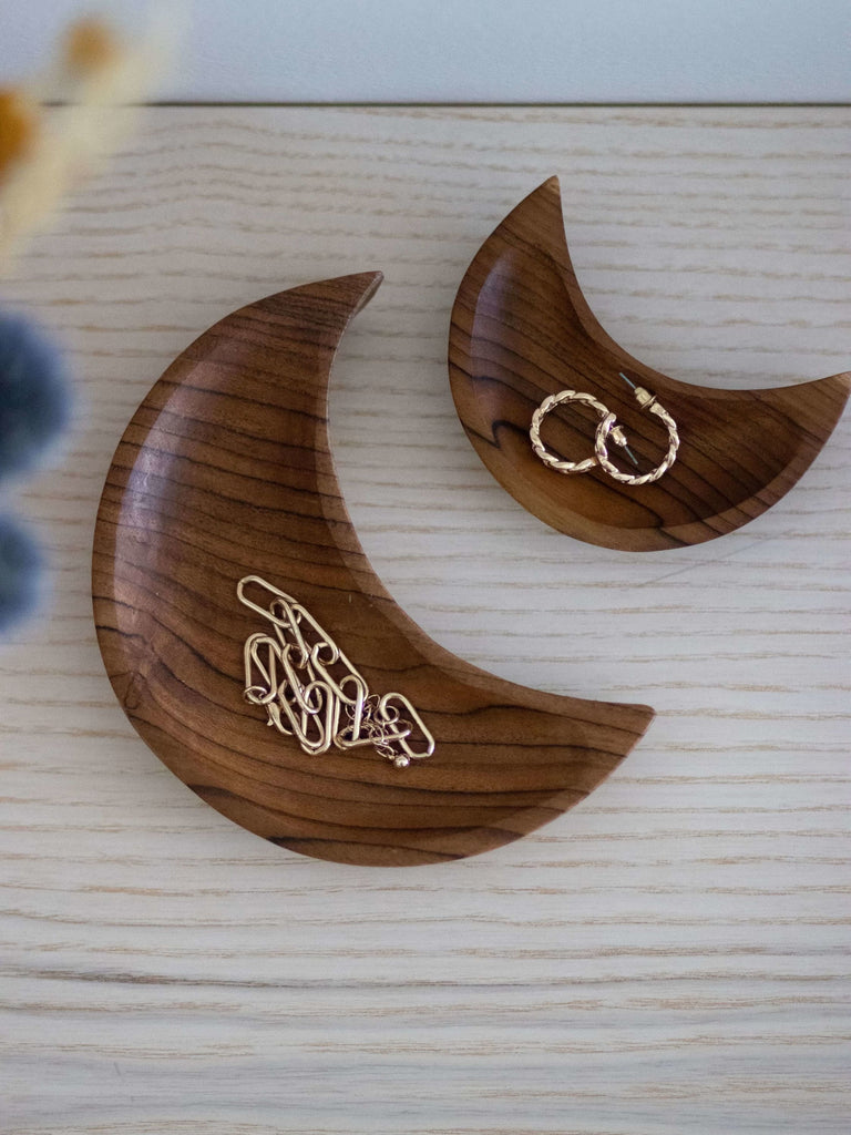 set of two handcarved crescent moon teak wood dishes holding dainty feminine jewelry