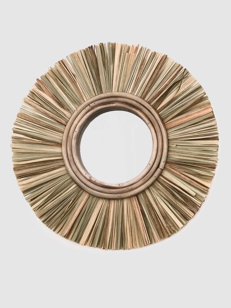 product photo of handmade natural brown fiber straw mirror on wall