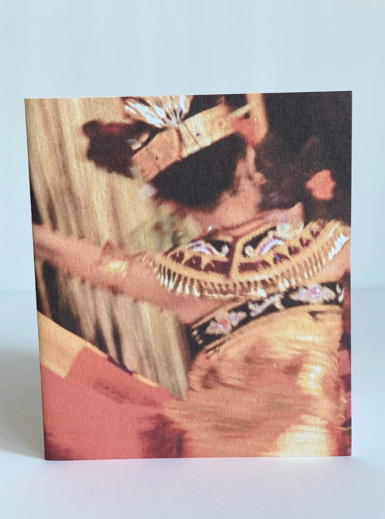 greeting card showing the back of an indonesian woman wearing traditional clothing while dancing