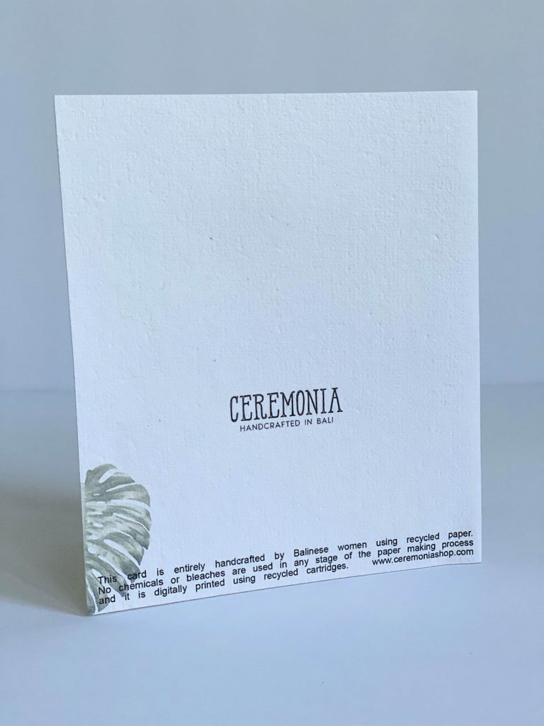 the back of the monstera stationary card with the CEREMONIA logo and a small monstera leaf on the side