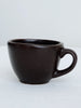 handmade dark brown high fire clay stoneware espresso mug with white background