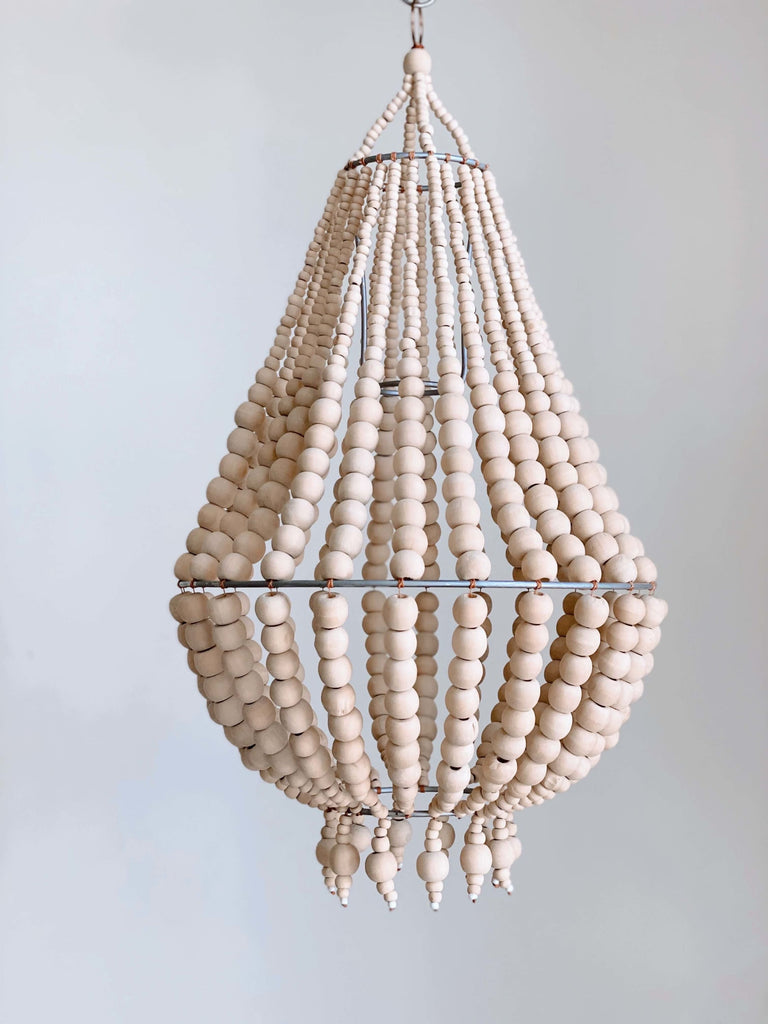 product photo of small handcarved natural wooden bead chandelier hanging with white background