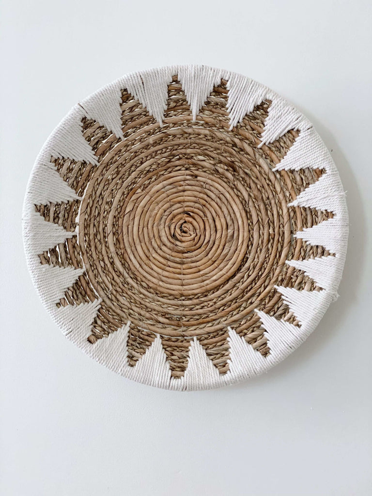 banana leaf seagrass macrame handwoven cream and brown wall basket hanging on white wall