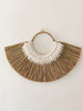 product shot of earthy bohemian mendong grass beaded wall hanging on white wall