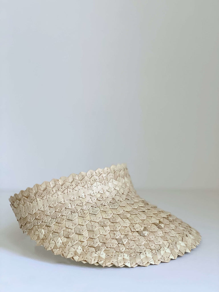 product photo of bohemian handwoven palm leaf natural sun visor with white background