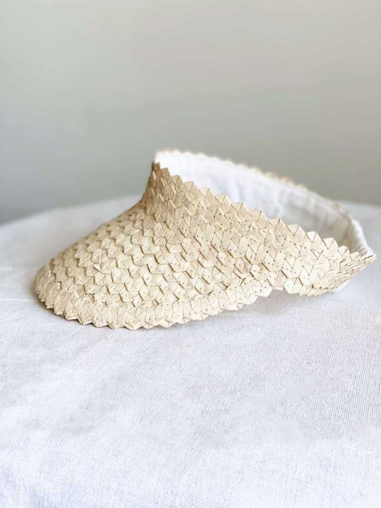 product photo of bohemian handwoven palm leaf natural kid size sun visor with white background