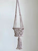 product photo of small handmade brown macrame plant hanger basket