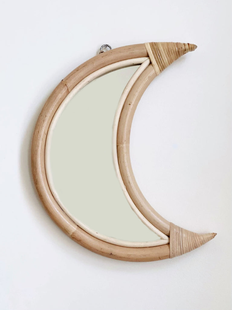product photo of small bohemian handmade rattan crescent moon mirror on white wall