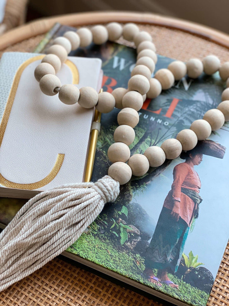 bohemian handcarved natural wooden bead cream tassel decoration on book